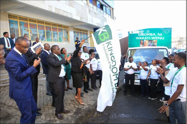 Kingdom Bank Board Chair Margaret Karangatha, accompanied by bank staff, flags off a market activation roadshow during the grand opening of the bank’s 20th branch in Gikomba. This expansion into Gikomba underscores Kingdom Bank’s strategic commitment to catering to markets, particularly MSMEs, where the bank holds significant domain expertise.
